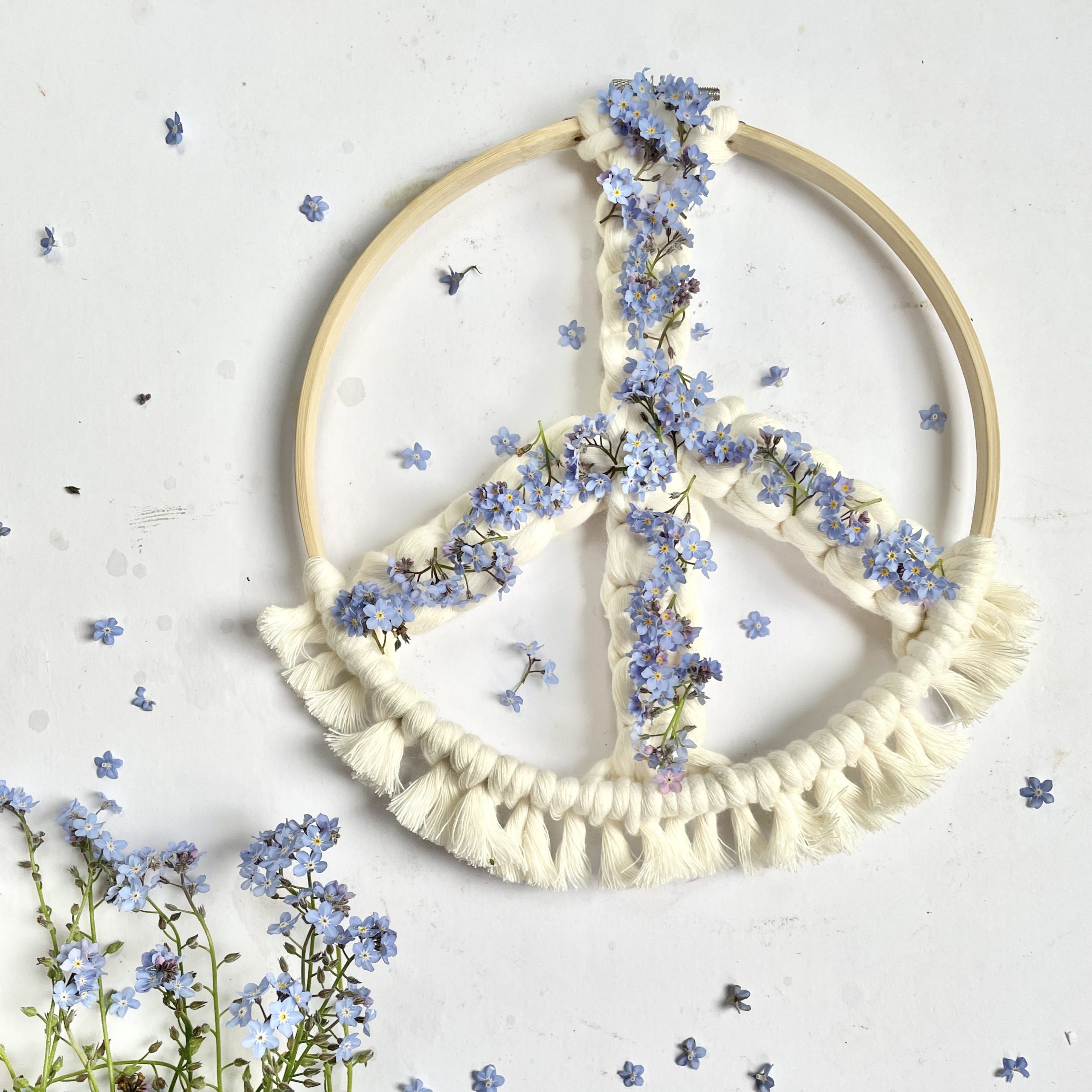 Macrame peace wreath with forget me not flowers