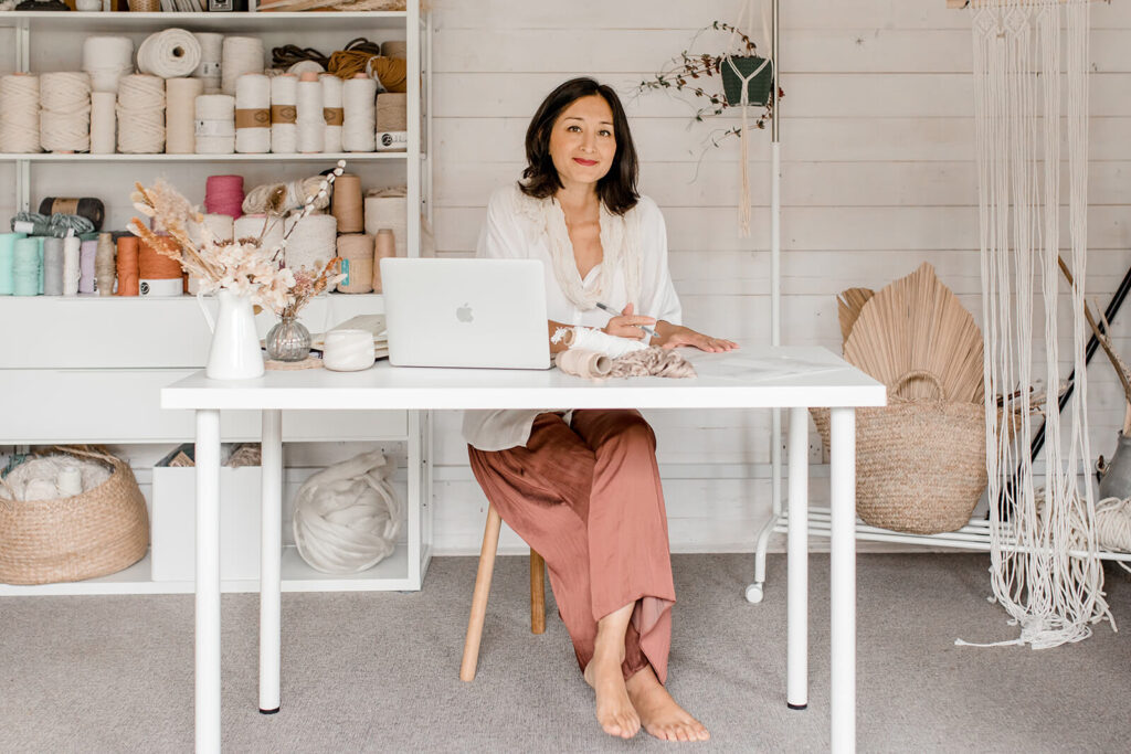 Isabella Strambio seating at her studio desk