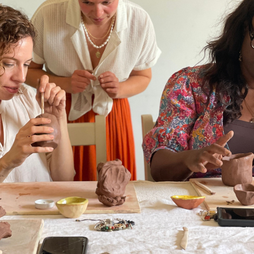 women making pottery at a macrame retreat