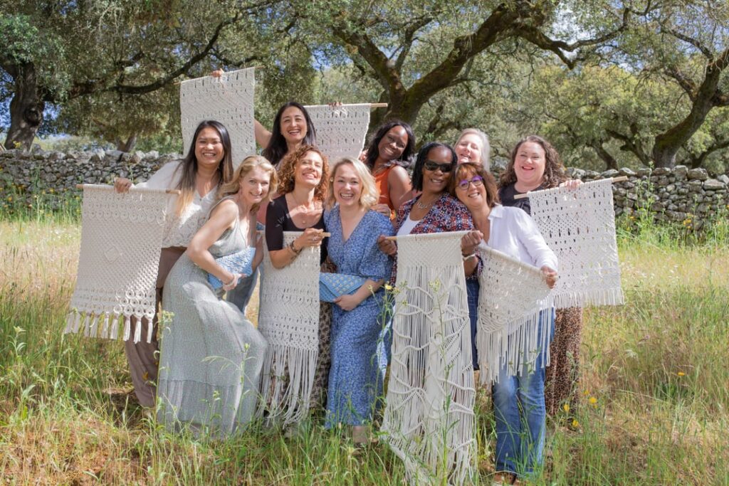 Ladies at the macrame retreat with their macrame piece celebrating
